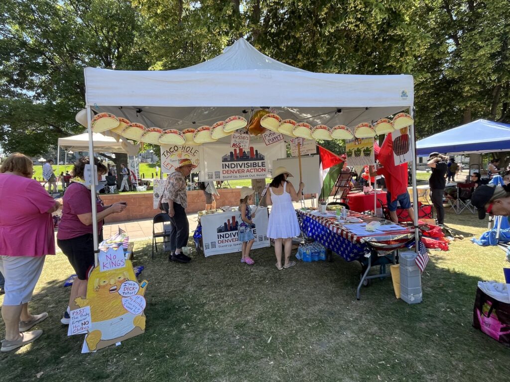 Indivisible Denver Action volunteer booth at No Kings Rally 