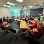 group of Indivisible Denver members at the monthly meeting