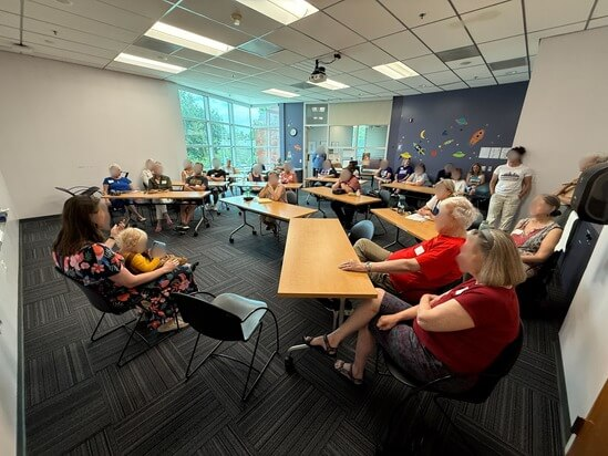 Speaker Blurred - Indivisible Denver group of Indivisible Denver members at the monthly meeting