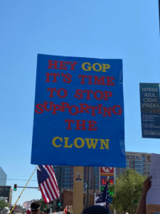 Protest sign that says, "Hey GOP it's time to stop supporting the clown"